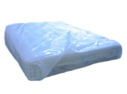 a mattress covered in the plastic protector