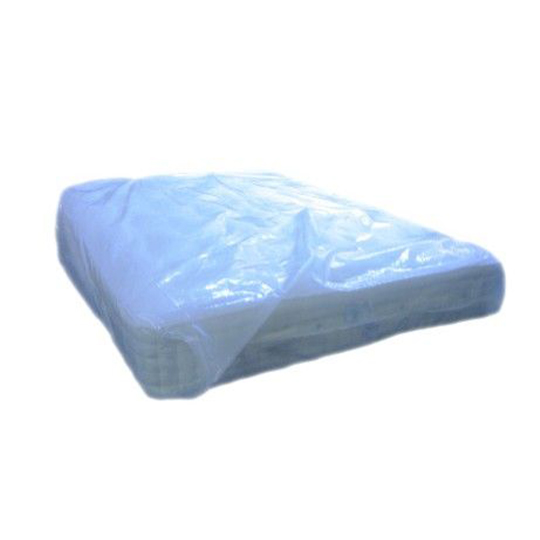 Mattress covered in plastic packaging.